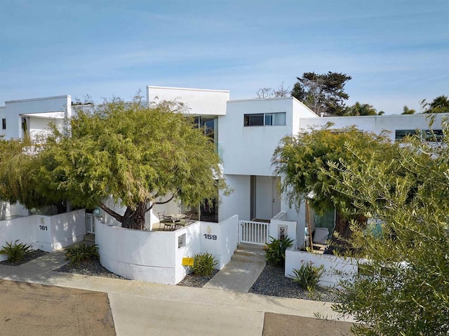 159 Mozart Ave, Cardiff By The Sea, CA 92007 - modern home featuring a fenced front yard, stucco siding, and a gate