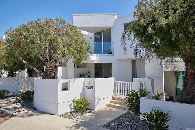 159 Mozart Ave, Cardiff By The Sea, CA 92007 - modern home featuring a fenced front yard and stucco siding