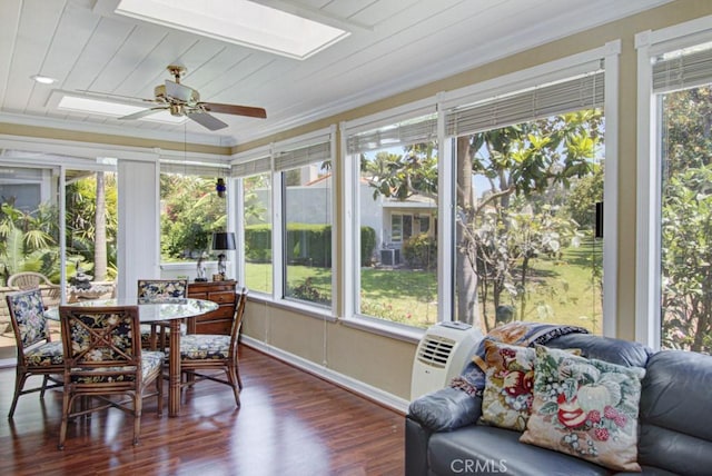 5521 Via La Mesa Unit C, Laguna Woods, CA 92637 - sunroom / solarium with a skylight, ornamental molding, plenty of natural light, and wood finished floors