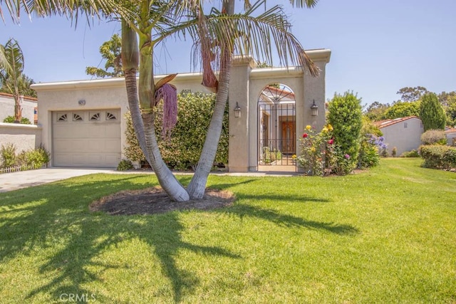 5521 Via La Mesa Unit C, Laguna Woods, CA 92637 - view of front of home featuring a garage, driveway, stucco siding, and a front lawn