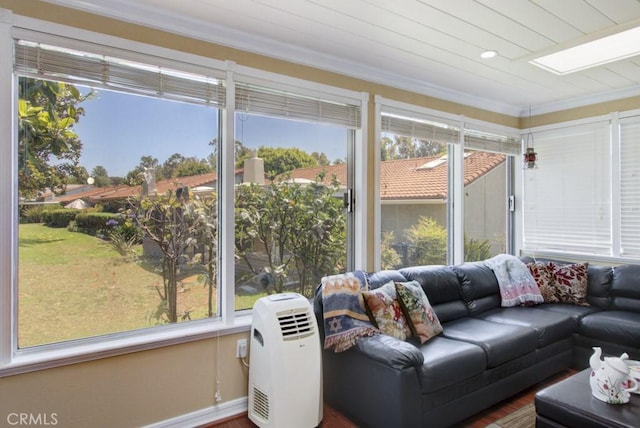 5521 Via La Mesa Unit C, Laguna Woods, CA 92637 - sunroom / solarium featuring healthy amount of natural light, crown molding, and wood finished floors