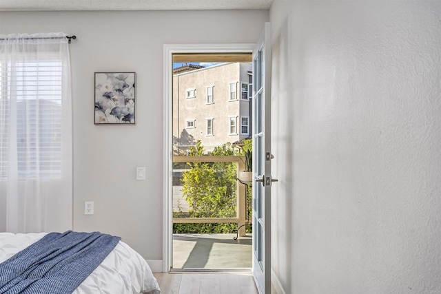 1508 Circa Del Lago Blvd Unit B204, San Marcos, CA 92078 - bedroom with wood finished floors and access to exterior