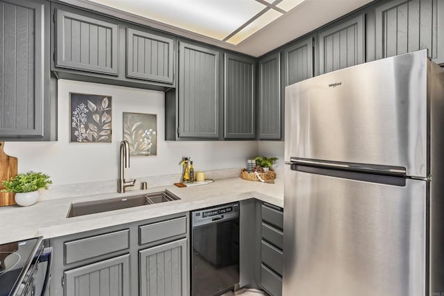 1508 Circa Del Lago Blvd Unit B204, San Marcos, CA 92078 - kitchen featuring freestanding refrigerator, black dishwasher, gray cabinetry, and light countertops