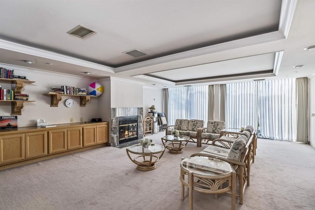 1508 Circa Del Lago Blvd Unit B204, San Marcos, CA 92078 - living room with a raised ceiling, light carpet, ornamental molding, a high end fireplace, and floor to ceiling windows