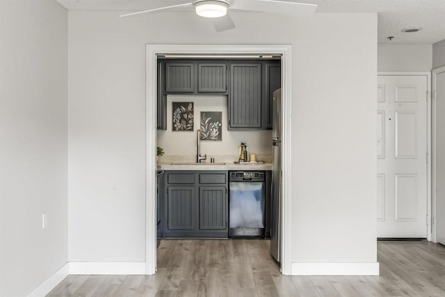 1508 Circa Del Lago Blvd Unit B204, San Marcos, CA 92078 - indoor wet bar featuring dishwashing machine, light wood finished floors, a ceiling fan, and freestanding refrigerator