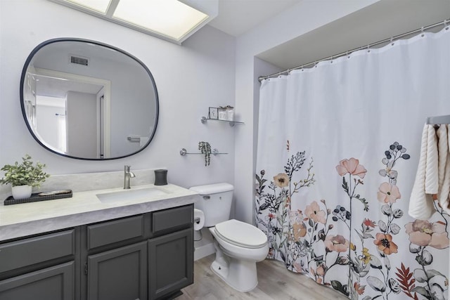 1508 Circa Del Lago Blvd Unit B204, San Marcos, CA 92078 - bathroom with vanity, wood finished floors, and a shower with curtain