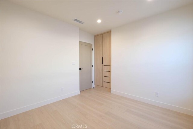 18852 Collins St, Tarzana, CA 91356 - empty room with light wood finished floors and recessed lighting