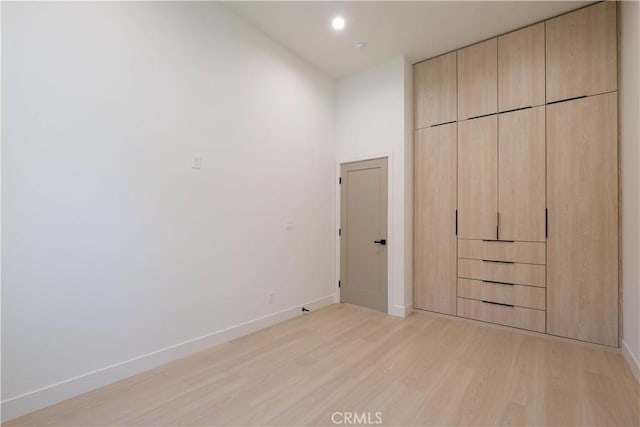 18852 Collins St, Tarzana, CA 91356 - unfurnished bedroom with light wood finished floors and recessed lighting