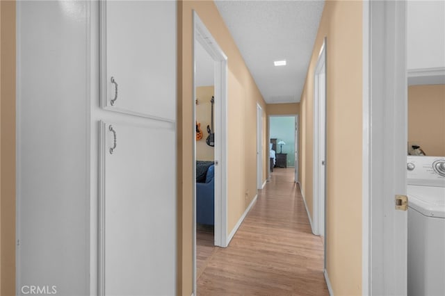 339 W Dawson Ct, Glendora, CA 91740 - hallway with washer / dryer and light wood finished floors