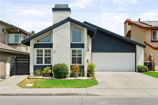 339 W Dawson Ct, Glendora, CA 91740 - mid-century inspired home featuring stucco siding, driveway, a garage, and a chimney