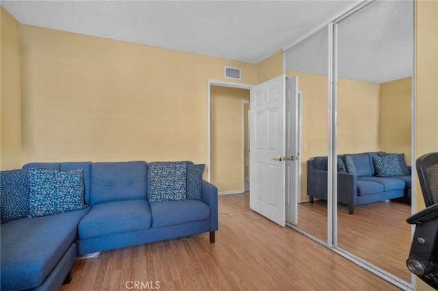 339 W Dawson Ct, Glendora, CA 91740 - living area featuring light wood finished floors and a textured ceiling