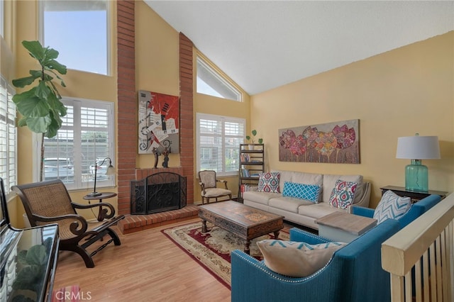 339 W Dawson Ct, Glendora, CA 91740 - living area with high vaulted ceiling, wood finished floors, and a fireplace