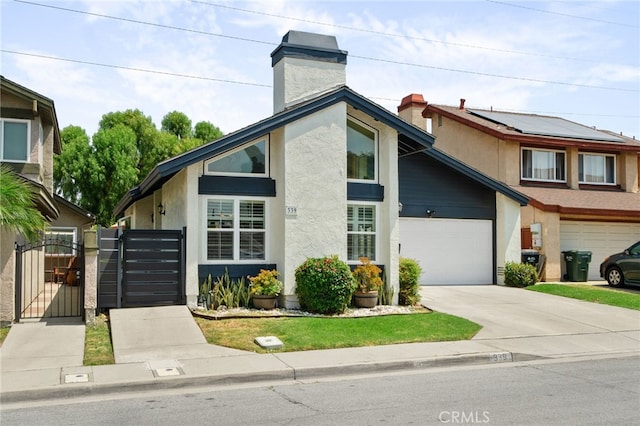 339 W Dawson Ct, Glendora, CA 91740 - view of front of property featuring a gate, stucco siding, concrete driveway, and a chimney
