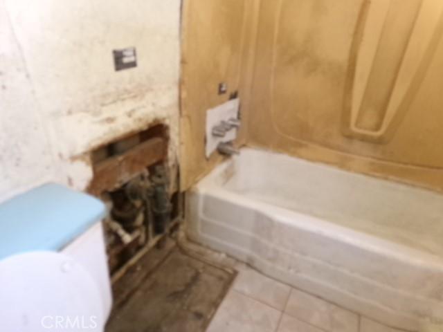 34915 Cedar Rd, Barstow, CA 92311 - full bath with shower / washtub combination and tile patterned floors