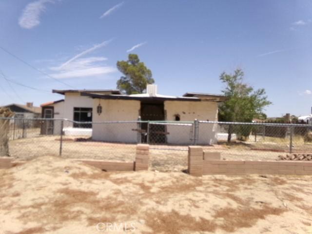 34915 Cedar Rd, Barstow, CA 92311 - view of front of home featuring stucco siding and a gate