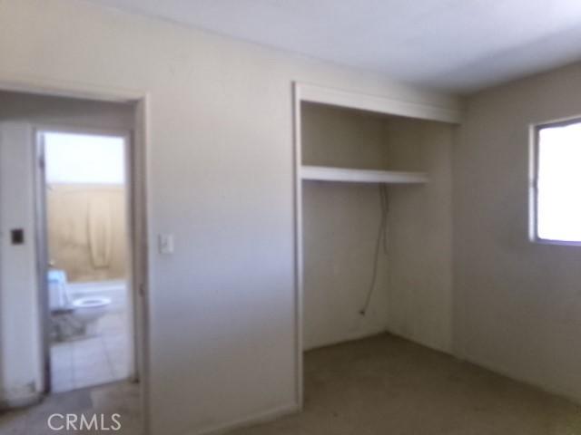 34915 Cedar Rd, Barstow, CA 92311 - unfurnished bedroom featuring a closet and ensuite bathroom