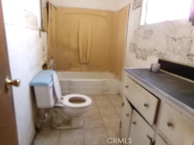 34915 Cedar Rd, Barstow, CA 92311 - bathroom with toilet and tile patterned floors