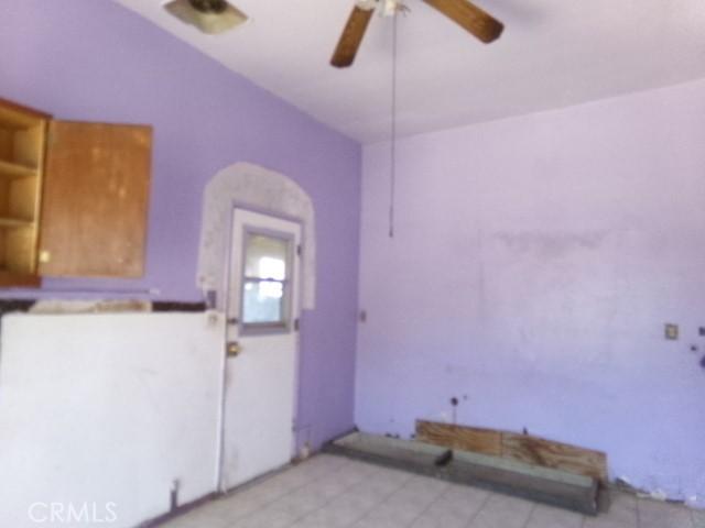 34915 Cedar Rd, Barstow, CA 92311 - spare room featuring ceiling fan and light tile patterned floors