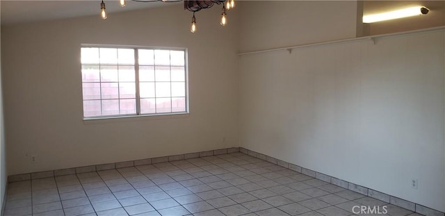 8894 Riverside, Riverside, CA 92503 - spare room featuring healthy amount of natural light, light tile patterned floors, and lofted ceiling