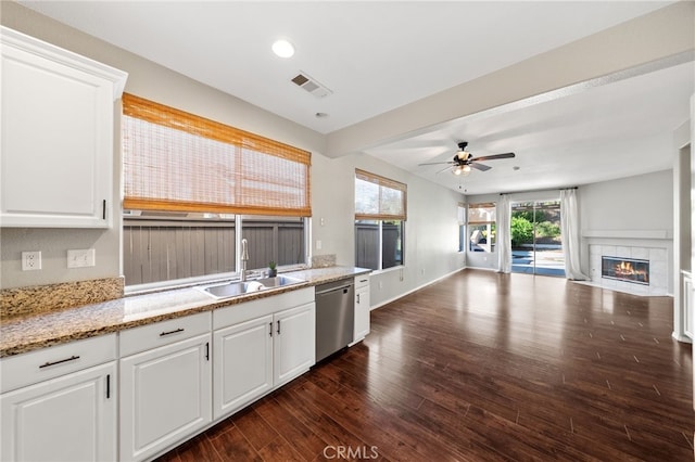 45114 Via Quivera, Temecula, CA 92592 - kitchen with dishwasher, open floor plan, dark wood-style flooring, a ceiling fan, and white cabinets