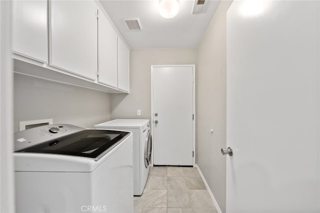 45114 Via Quivera, Temecula, CA 92592 - laundry area featuring cabinet space and washing machine and clothes dryer