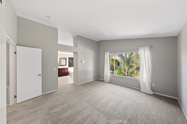 45114 Via Quivera, Temecula, CA 92592 - empty room with carpet and vaulted ceiling