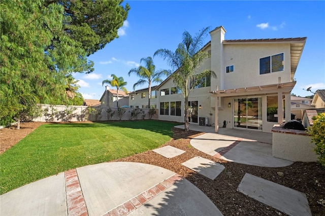 45114 Via Quivera, Temecula, CA 92592 - back of property with a fenced backyard, stucco siding, a patio area, and a chimney