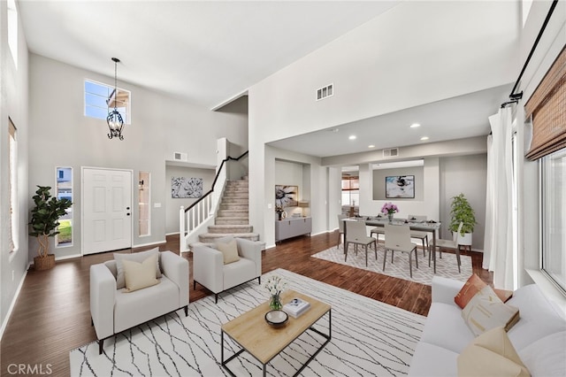 45114 Via Quivera, Temecula, CA 92592 - living area with a high ceiling, wood finished floors, plenty of natural light, stairway, and recessed lighting