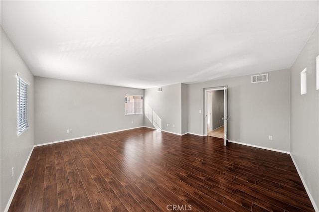 45114 Via Quivera, Temecula, CA 92592 - spare room with healthy amount of natural light and dark wood-type flooring