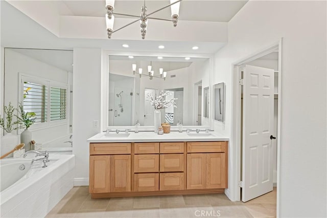 6 Baristo Unit 39, Irvine, CA 92612 - full bathroom featuring a chandelier, a bath, double vanity, tile patterned flooring, and recessed lighting