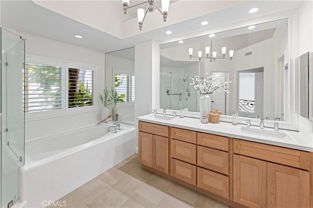 6 Baristo Unit 39, Irvine, CA 92612 - full bathroom with a chandelier, a bath, double vanity, recessed lighting, and a stall shower
