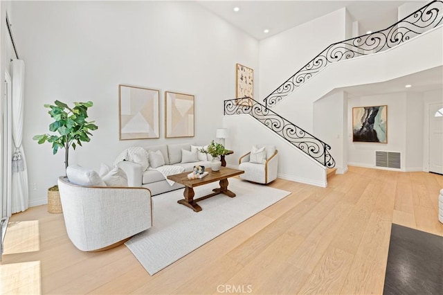 6 Baristo Unit 39, Irvine, CA 92612 - living area with a high ceiling, wood finished floors, recessed lighting, and stairway