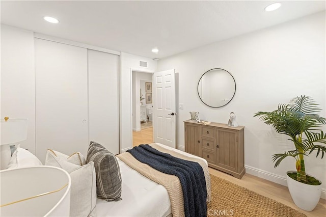 6 Baristo Unit 39, Irvine, CA 92612 - bedroom with light wood-type flooring, recessed lighting, and a closet