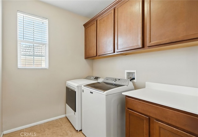 31969 Frontier Manor St, Menifee, CA 92584 - laundry room featuring washer and clothes dryer, cabinet space, and light tile patterned flooring