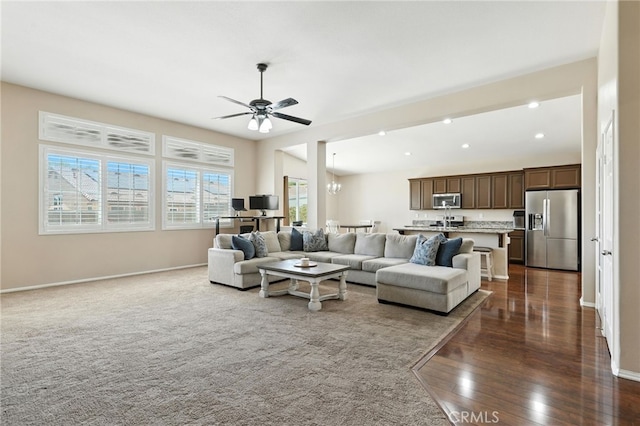 31969 Frontier Manor St, Menifee, CA 92584 - living area with dark wood finished floors, a ceiling fan, recessed lighting, and a chandelier