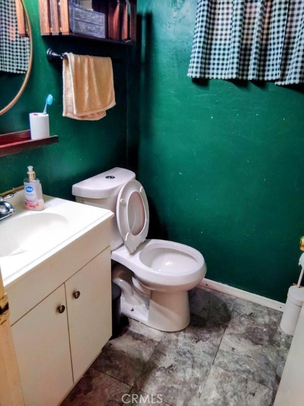 9778 Sharon Ave, Riverside, CA 92503 - bathroom with toilet and vanity
