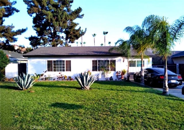 9778 Sharon Ave, Riverside, CA 92503 - view of front of property featuring a front lawn and stucco siding