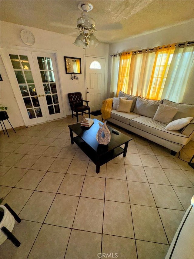 9778 Sharon Ave, Riverside, CA 92503 - living area featuring a textured ceiling, french doors, tile patterned flooring, and ceiling fan