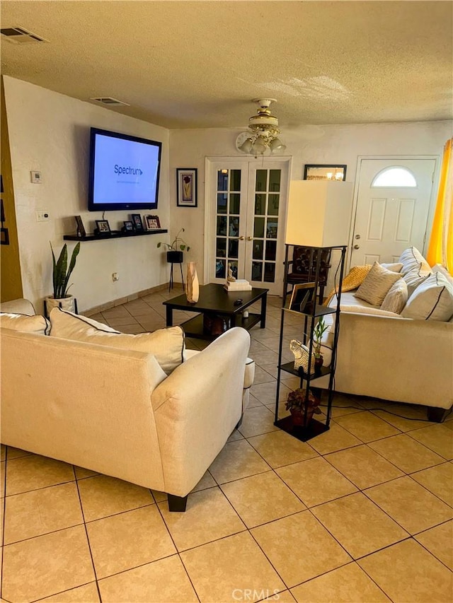9778 Sharon Ave, Riverside, CA 92503 - living room with french doors, light tile patterned floors, and a textured ceiling