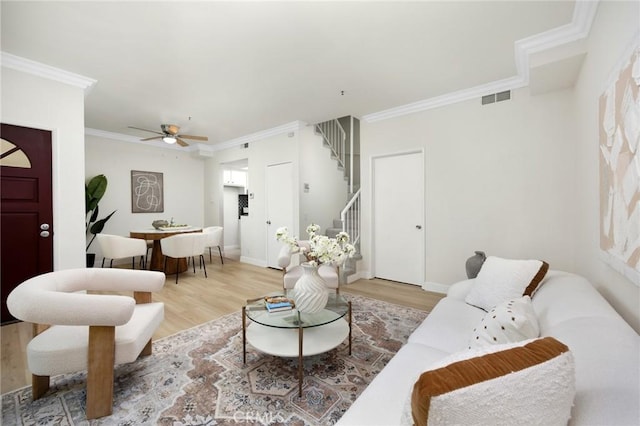 222 S Catalina Ave Unit 8, Pasadena, CA 91106 - living room featuring stairway, light wood-style flooring, crown molding, and a ceiling fan