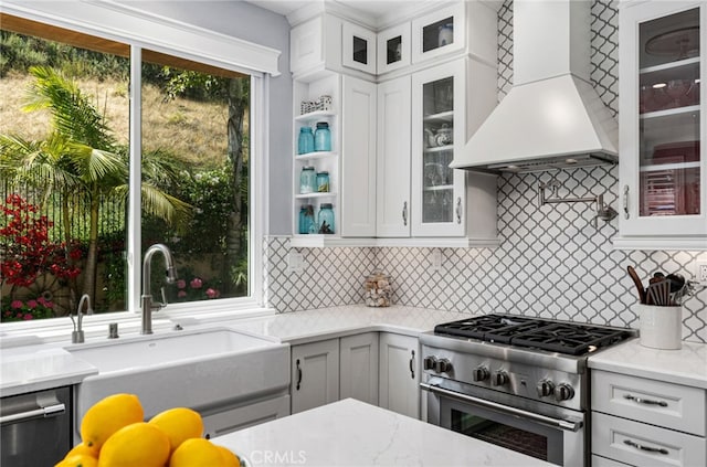 611 Del Dios, San Clemente, CA 92672 - kitchen with custom exhaust hood, high end stove, tasteful backsplash, and light stone counters