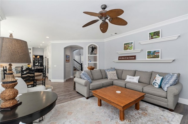 611 Del Dios, San Clemente, CA 92672 - living area featuring arched walkways, ceiling fan, wood finished floors, ornamental molding, and recessed lighting
