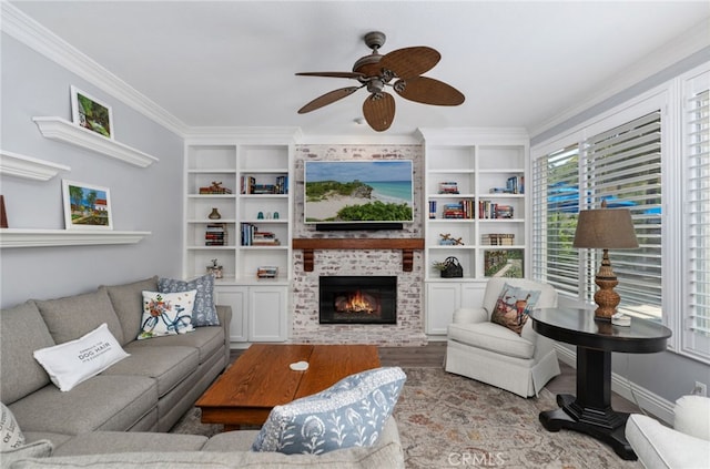 611 Del Dios, San Clemente, CA 92672 - living area featuring ornamental molding, a fireplace, a ceiling fan, wood finished floors, and built in shelves