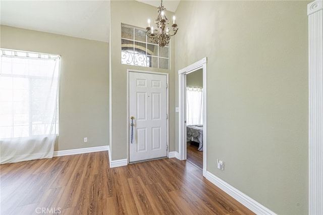 5808 Monterey Pl, Palmdale, CA 93552 - entryway featuring a chandelier and wood finished floors