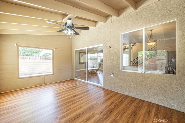 5808 Monterey Pl, Palmdale, CA 93552 - spare room with wood finished floors, beam ceiling, and a ceiling fan