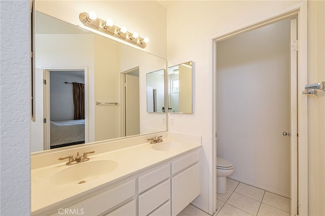 5808 Monterey Pl, Palmdale, CA 93552 - ensuite bathroom with double vanity and tile patterned flooring