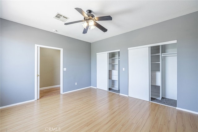 5808 Monterey Pl, Palmdale, CA 93552 - unfurnished bedroom featuring multiple closets, light wood-style floors, and ceiling fan