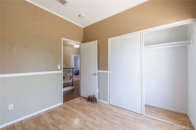 5808 Monterey Pl, Palmdale, CA 93552 - bedroom featuring wood finished floors, a closet, and ornamental molding
