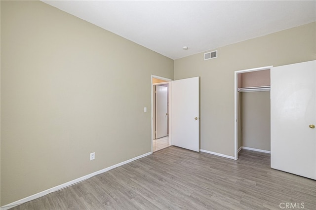 5808 Monterey Pl, Palmdale, CA 93552 - unfurnished bedroom with wood finished floors and a closet