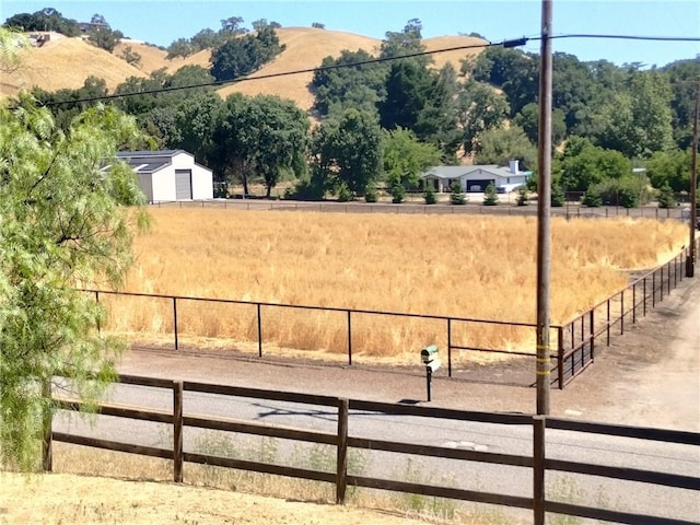 13205 Santa Lucia Rd, Atascadero, CA 93422 - view of yard with an enclosed riding area, a view of rural / pastoral area, a mountain view, and a detached garage